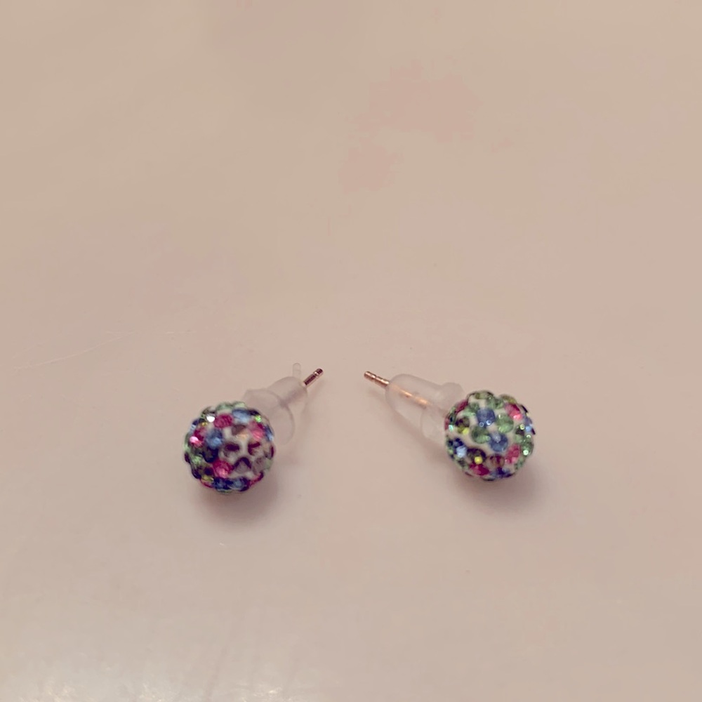 Small sparkly earrings with rubber backings